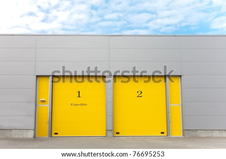industrial warehouse with yellow roller doors