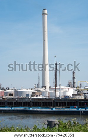 industrial building with large chimney in rotterdam harbor