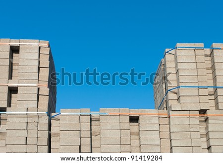 highly piled up bricks ready for transport