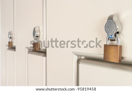 safety locks on white industrial metal lockers