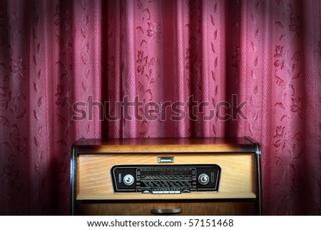 Old vintage radio with city names on red background! Ideal for concept photo