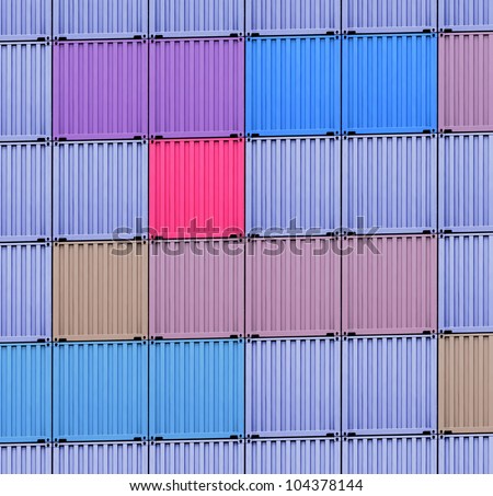 background of multi-colored freight shipping containers at the docks