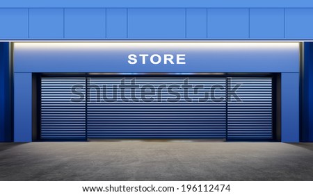 modern empty store with roller shutter doors on street at night time