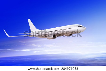 flying-up white passenger airplane in the sky at sunrise