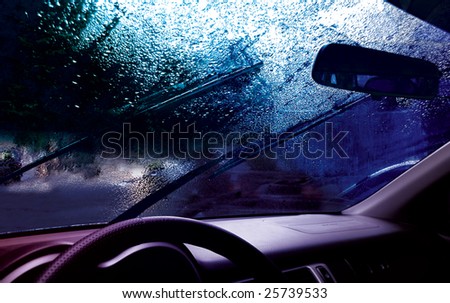 facia of the car and drops on the windshield