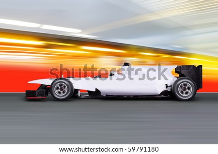 formula one car driving at high speed on empty road - motion blur