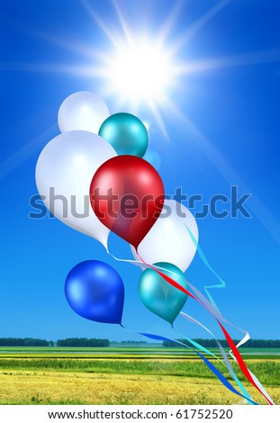 toy balloons soaring in the blue sky under shining sun