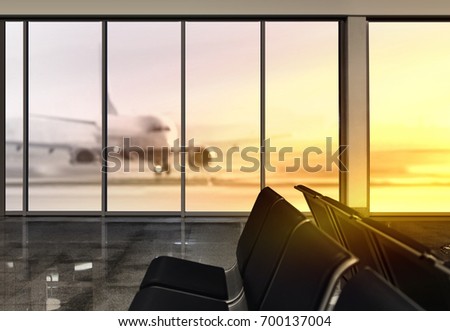 window in airport at morning, plane expects tourists at airport