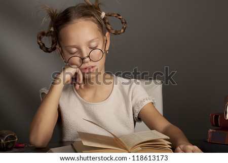 eight years old caucasian girl with the books