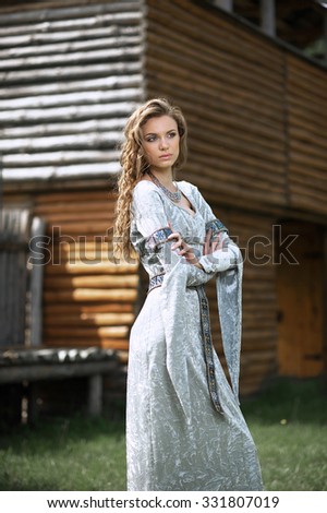 fairy princess in a beautiful black dress in a wooden tower
