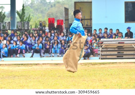 CHIANG MAI THAILAND - JAN 17\
Unidentified  Students were competing to Sack race  in  rural School of Thailand on JANUARY 17 , 2015 at Jamluang school in Chiang  Mai Thailand