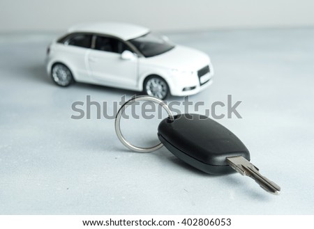 keys and car on white background. Car insurance. Automobile collision damage waiver concepts. with protective gesture and icon of car. Protection of car. Business concept.