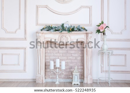white fireplace in light room with Christmas decoration