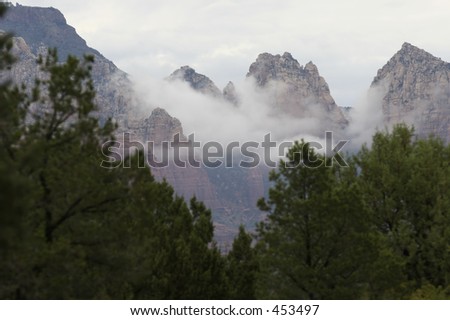 USA Arizona Sedona View with clouds hanging in the top of the mountains