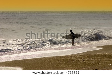 Surfer at Sunset Gold Coast Florida USA (exclusive at shutterstock)