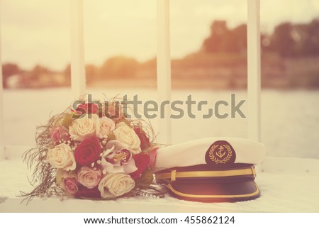 Wedding bouquet and sailor cap.