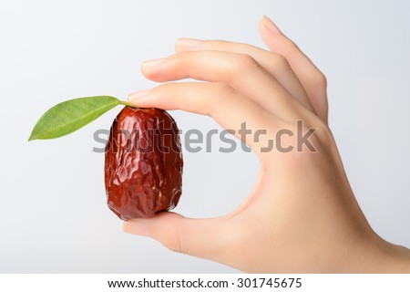 dried date fruit, dry jujube fruit in the hand