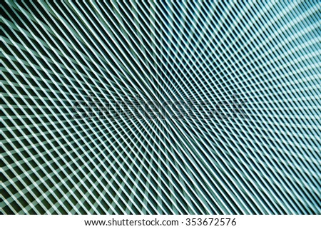 Tilt photo of metal grid. Unobtrusive hi tech or scientific background composition with radiant / cellular structure. Contemporary wallpaper template.