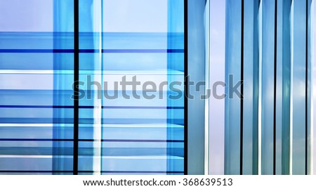 Double exposure close-up photo of parallel metal frames of French windows and patio doors. Material design on the subject of modern glass architecture. Hi-tech background for a list.