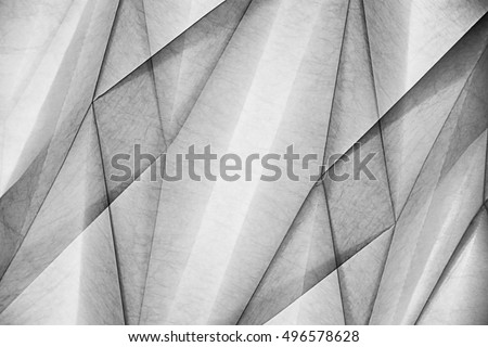 Double exposure of wall or ceiling relief structure with polygonal pattern. Abstract black and white background on the subject of modern architecture, interior and finishing materials.