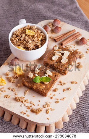 oat bar on wooden board, close-up