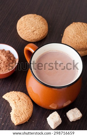 cup of hot chocolate and sugar cubes, vertical, close-up
