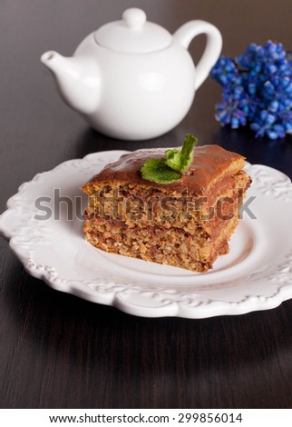 piece of carrots cake with chocolate cream, decorated mint, vertical