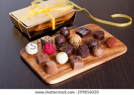 Chocolate handmade candies on a kitchen table. Chocolate box, close up, horizontal