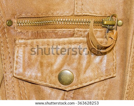 Pocket of leather brown jacket as a background