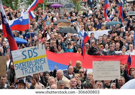 LJUBLJANA, SLOVENIA, 7 July 2014: Crowd of people gather for demonstration with Slovenian flags and banners to protest in support of Slovenian politician, Janez Jansa.