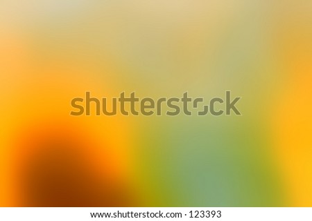 Bright abstract background in rich gold, yellow and green tones of blurred light