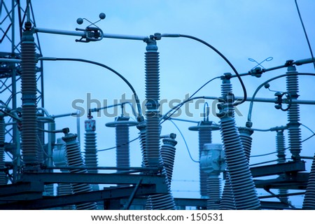 blue toned photo of a power station transformers