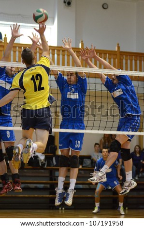 KAPOSVAR, HUNGARY - MAY 18: Unidentified players in action at the final of the hungarian junior volleyball championship (Dag yellow vs. Dunaferr  blue) , May 18, 2012 in Kaposvar, Hungary