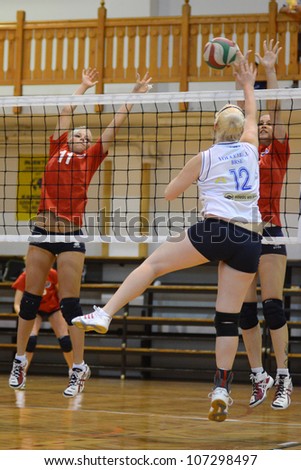 KAPOSVAR, HUNGARY - MAY 18: Unidentified players in action at the final of the hungarian junior volleyball championship (Vasas red vs. Bekescsaba white), May 18, 2012 in Kaposvar, Hungary