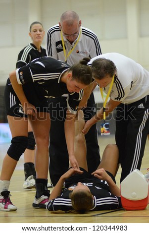 SIOFOK, HUNGARY - NOVEMBER 17: Unidentified player injured at EHF Cup handball match Siofok (black) (HUN) vs. Astrakhanochka (purple) (RUS) November 17, 2012 in Siofok, Hungary.