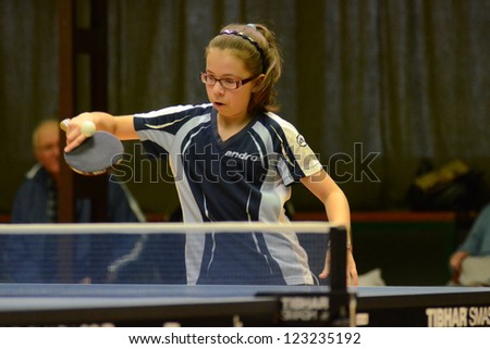 KAPOSVAR, HUNGARY - NOVEMBER 18: Laura Magyarcsik in action at a Hungarian National Championship II. table tennis game Kaposvar (blue) vs. Noszlop (white) November 18, 2012 in Kaposvar, Hungary.