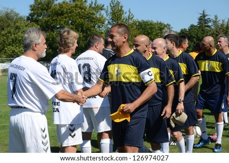 BUDAPEST - SEPTEMBER 9: Competitors shake hands at a I. International Senior Football Festival game Rakosmenti TK HUN (white) vs. Pantanal BRA (black) September 9, 2012 in Budapest.