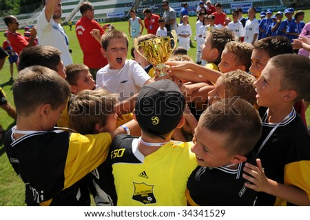 KAPOSVAR, HUNGARY - JULY 24: The winner romanian players are glad at the V. Youth Football Festival Under 9 Final - Atletico Arad (ROM) vs FC Goldstein (GER) - July 24, 2009 in Kaposvar, Hungary