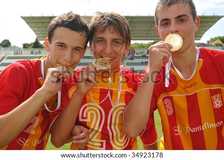 KAPOSVAR, HUNGARY - JULY 25: Bucuresti players show their medals at the V. Youth Football Festival Under 17 Final - Bucuresti (ROM) vs Bresscia SC (ITA) - July 25, 2009 in Kaposvar, Hungary.