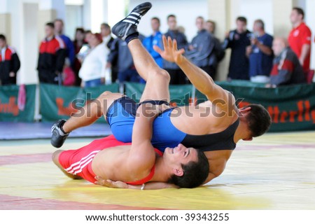 KAPOSVAR, HUNGARY - OCTOBER 18: Two competitors wrestle in the Hungarian Wrestling Team Championship, October 18, 2009 in Kaposvar, Hungary.