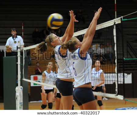 KAPOSVAR, HUNGARY - OCTOBER 14: Kondor (8) and Horvath (5) in action at the Hungarian Cup woman volleyball game Kaposvar vs Godollo, October 14, 2009 in Kaposvar, Hungary.