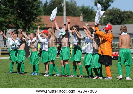 KAPOSVAR, HUNGARY - JULY 20: Unidentified winner players are glad at the V. Youth Football Festival match - July 20, 2009 in Kaposvar, Hungary.