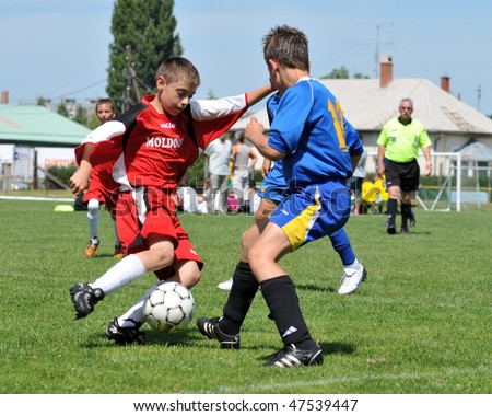 KAPOSVAR, HUNGARY - JULY 22: Unidentified players in action at the V. Youth Football Festival match, held July 22, 2009 in Kaposvar, Hungary.
