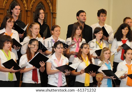 KAPOSVAR, HUNGARY - AUGUST 26: Members of the Liszt Ferenc Music School Choir sing at the IV. Pannonia Cantat Youth Choir Festival August 26, 2010 in Kaposvar, Hungary