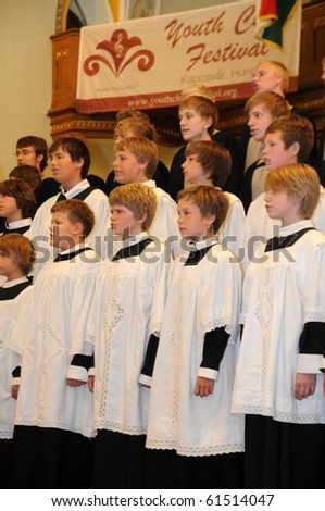KAPOSVAR, HUNGARY - AUGUST 26: Members of the St Michael\'s boys Choir (EST) sing at the IV. Pannonia Cantat Youth Choir Festival August 26, 2010 in Kaposvar, Hungary