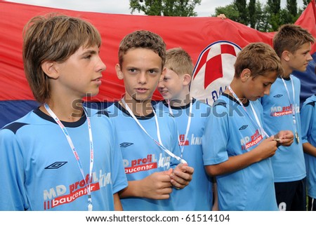 KAPOSVAR, HUNGARY - JULY 24: Croatian players look at their medals at the VI. Youth Football Festival Under 13 NK Dakovo (CRO) vs NK FK 7 Tuzla (BOS) July 24, 2010 in Kaposvar, Hungary
