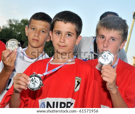 KAPOSVAR, HUNGARY - JULY 24: Tuzla players show their silver medal after the VI. Youth Football Festival Under 12 Final FK Novi Grad (BOS) vs. FK 7 Tuzla (BOS) July 24, 2010 in Kaposvar, Hungary