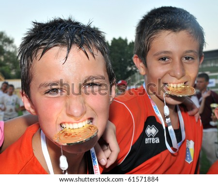 KAPOSVAR, HUNGARY - JULY 24: Novi Grad players show their medal the win after the VI. Youth Football Festival Under 12 Final FK Novi Grad (BOS) vs. FK 7 Tuzla (BOS) July 24, 2010 in Kaposvar, Hungary