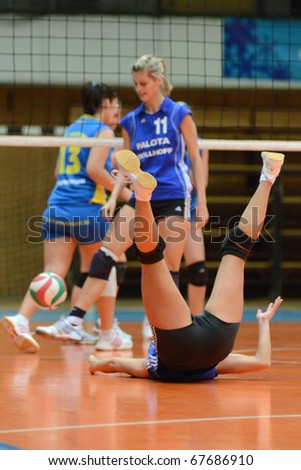 KAPOSVAR, HUNGARY - DECEMBER 19: Unidentified players in action at the Hungarian NB I. League woman volleyball game Kaposvar vs Palota Bollhoff on December 19, 2010 in Kaposvar, Hungary.