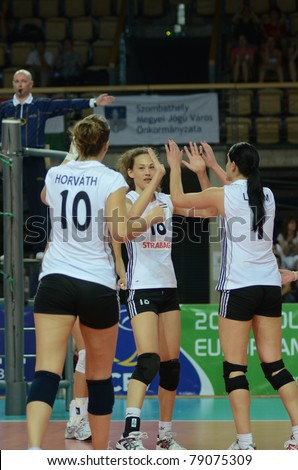 SZOMBATHELY, HUNGARY - JUNE 3: Hungarian players celebrate at a CEV European League woman\'s volleyball game Hungary vs Bulgaria on June 3, 2011 in Szombathely, Hungary.
